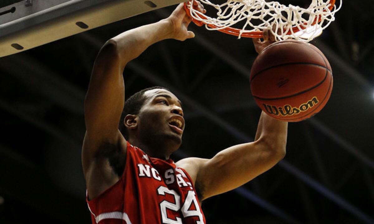 North Carolina State's T.J. Warren dunks during the second half of the Wolfpack's 74-59 win over Xavier in an NCAA tournament play-in game Tuesday.
