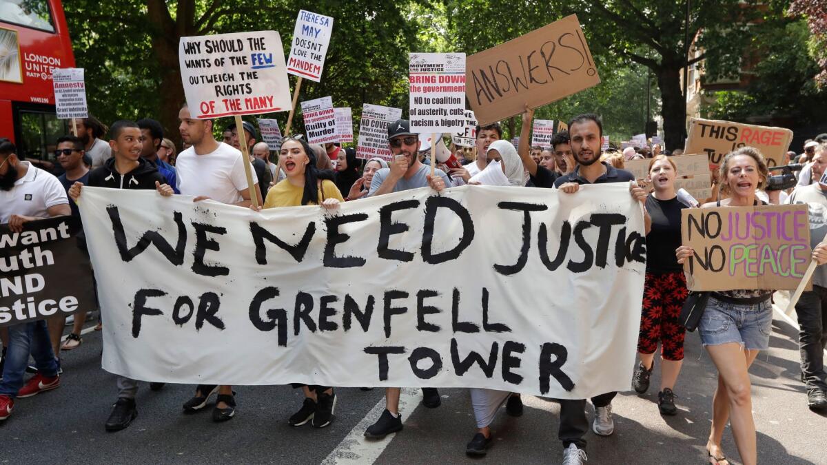 Demonstrators march towards Parliament in a June 21 protest in central London.