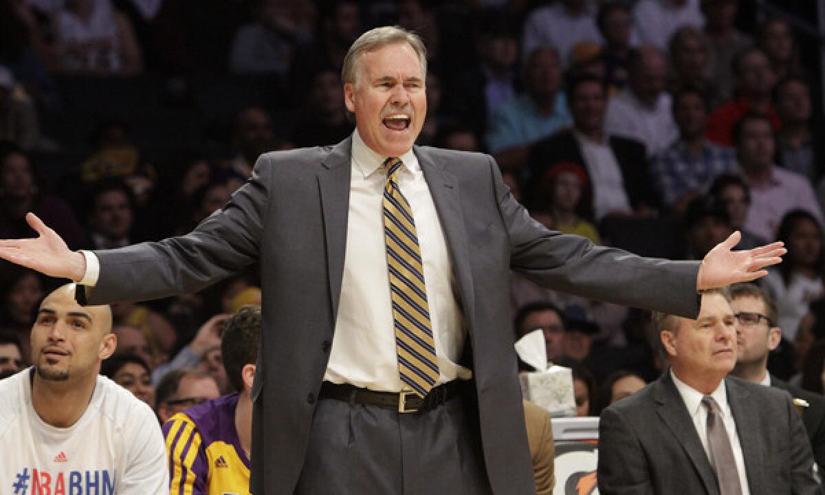 Lakers Coach Mike D'Antoni shouts during a loss to the Utah Jazz on Feb. 11. Firing D'Antoniin the middle of the season would not help the team.