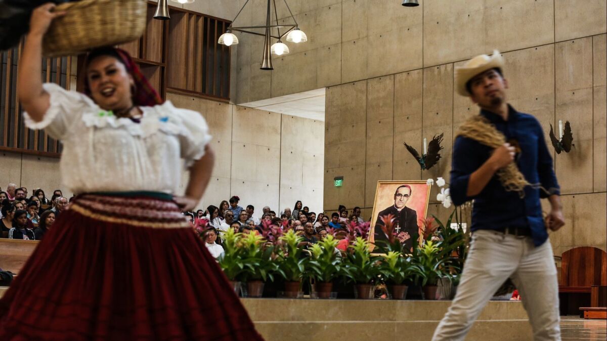 Folkloric dancers celebrate the canonization of Salvadoran Archbishop Oscar Romero on Sunday at the Cathedral of Our Lady of the Angels in downtown Los Angeles.