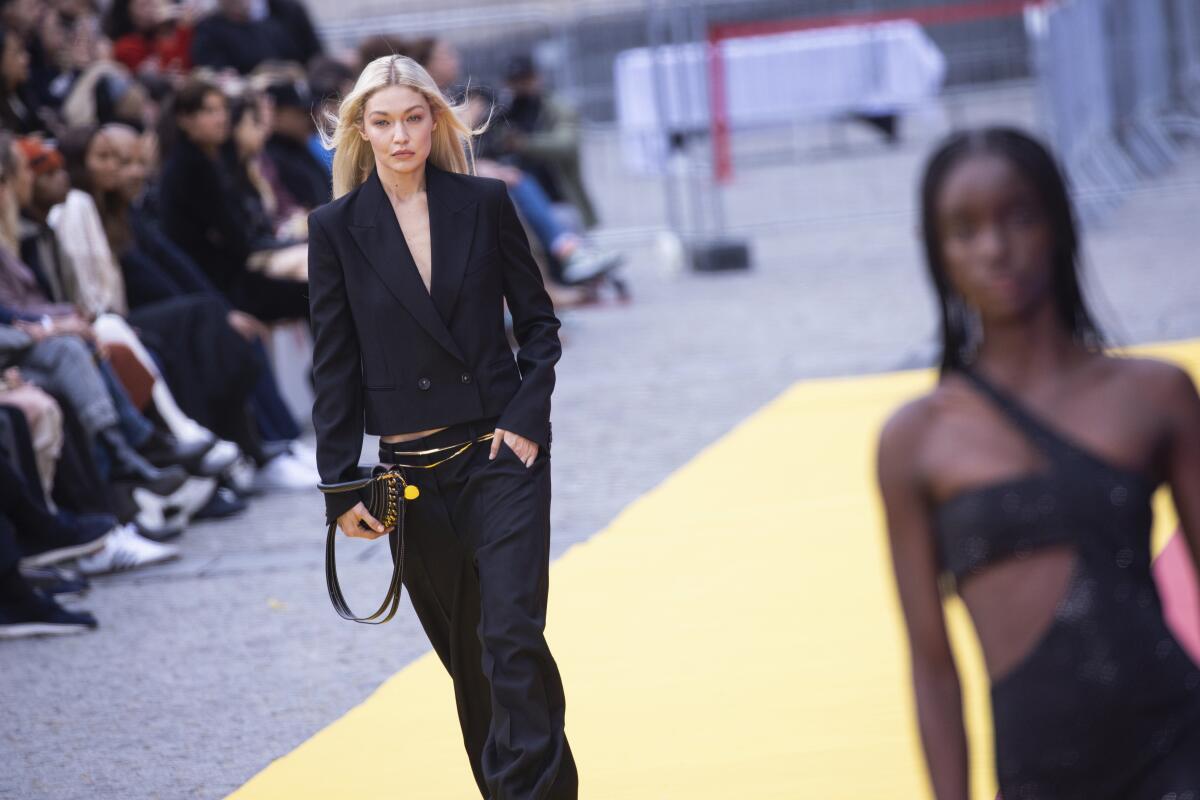 A model walks on a high-fashion runway during a show in Paris.