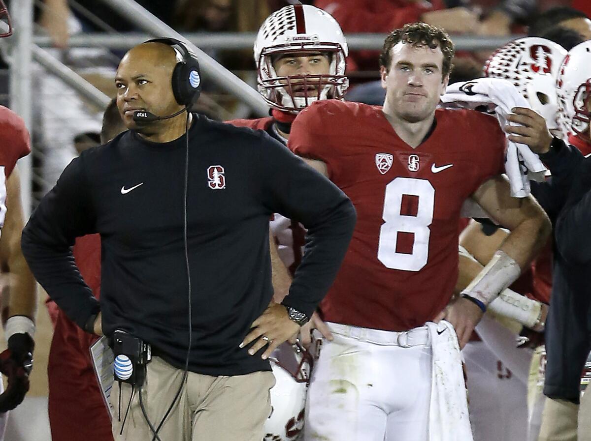 Stanford quarterback Kevin Hogan (8) and head coach David Shaw, left, watch from the sideline in a 38-36 loss to Oregon.