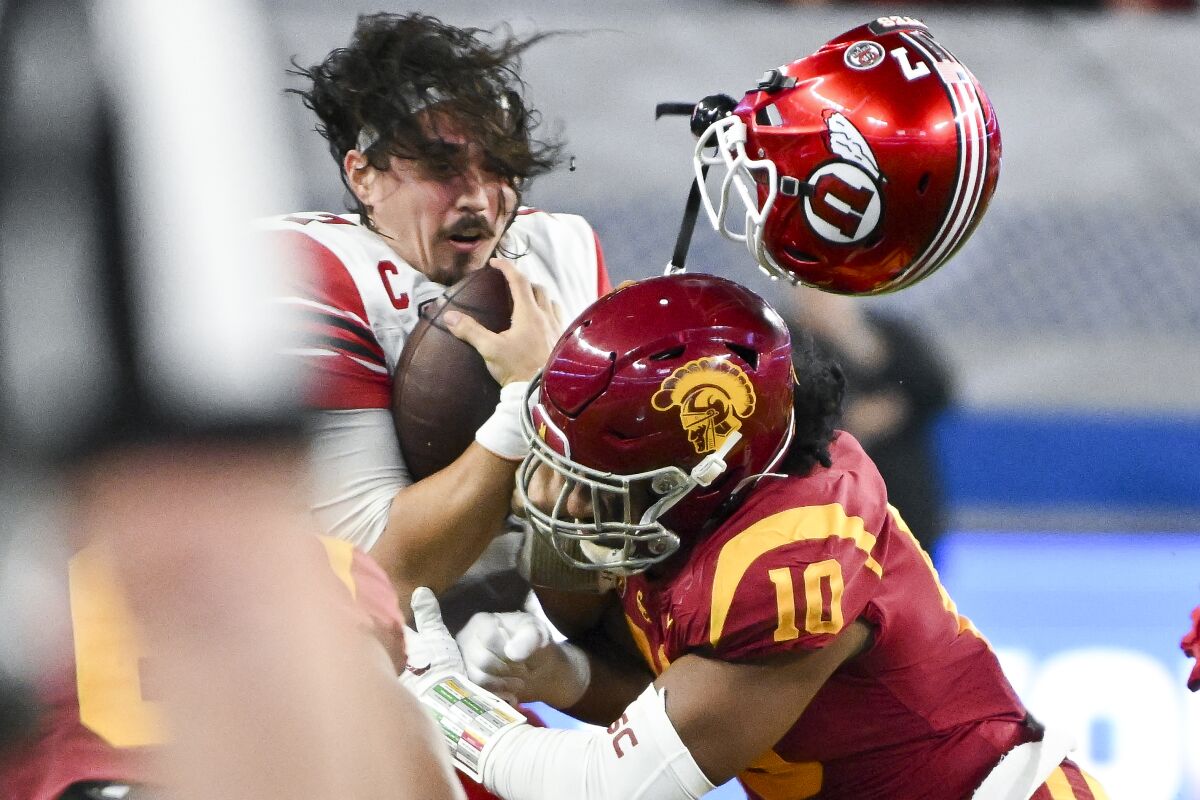 Utah quarterback Cameron Rising loses his helmet on a hit by USC linebacker Ralen Goforth during the third quarter.