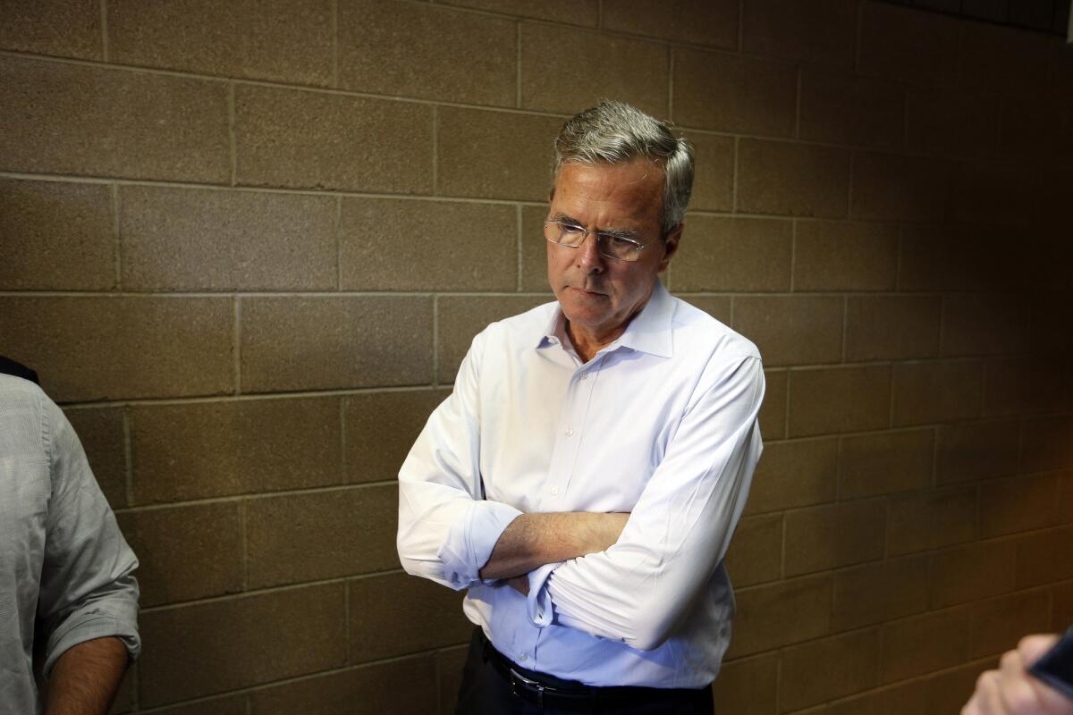 Republican presidential candidate and former Florida Gov. Jeb Bush waits in a hallway after a campaign event in Henderson, Nev. in June. Bush raised $11.4 million in 16 days after formally launching his campaign for president, his campaign said last week.