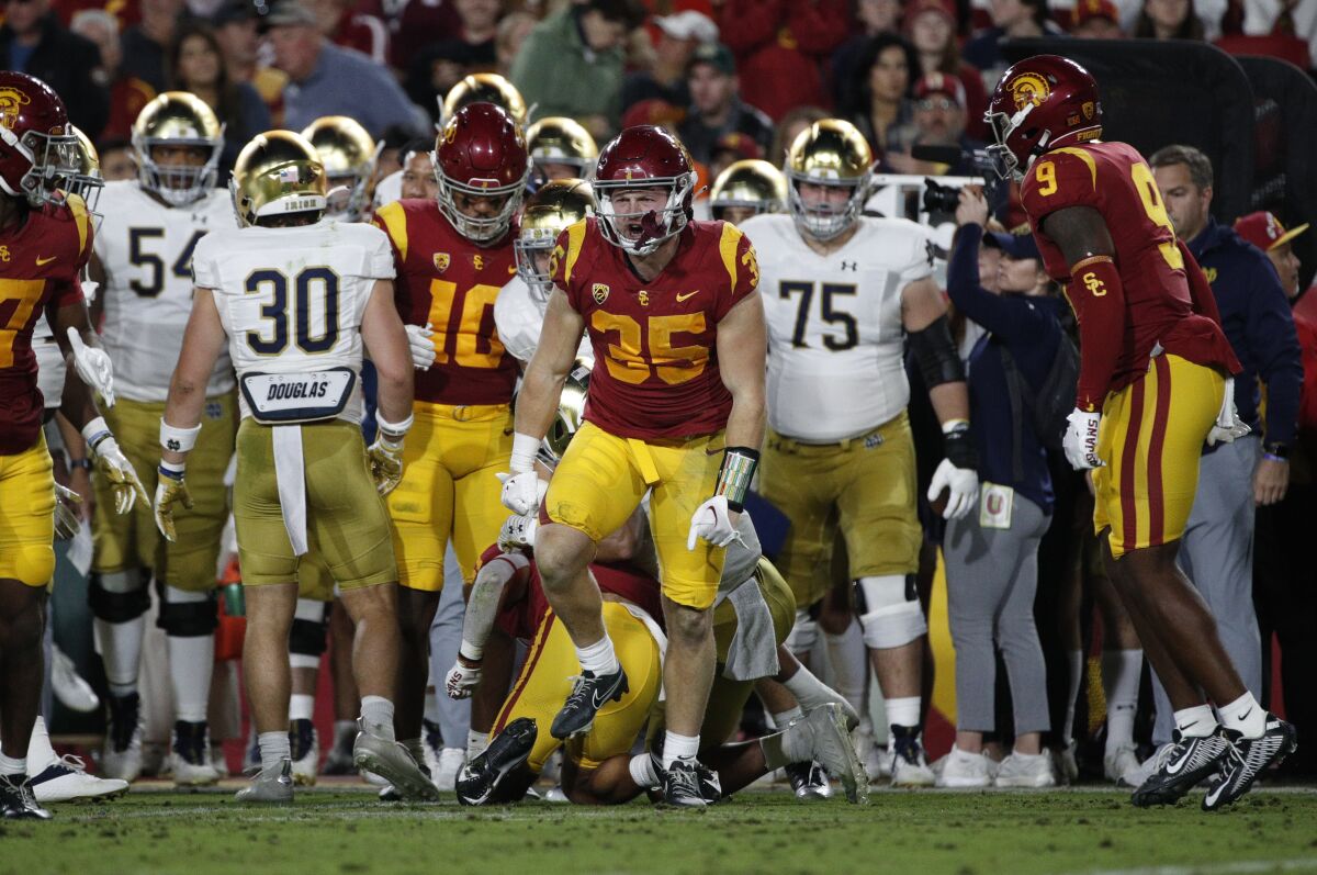 USC linebacker Clyde Moore reacts after a defensive stop against Notre Dame at the Coliseum
