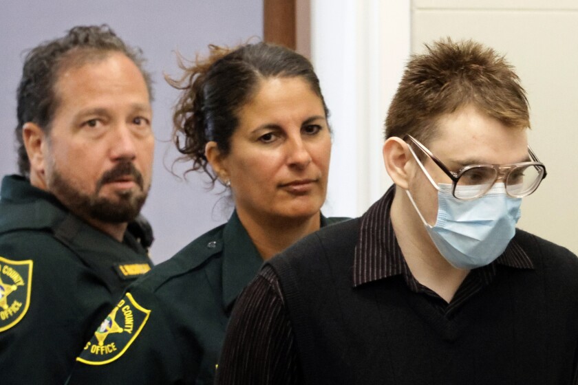 Marjory Stoneman Douglas High School shooter Nikolas Cruz is led into court during the penalty phase of his trial at the Broward County Courthouse in Fort Lauderdale, Fla., Tuesday, July 19, 2022. Cruz previously plead guilty to all 17 counts of premeditated murder and 17 counts of attempted murder in the 2018 shootings. (Mike Stocker/South Florida Sun Sentinel via AP, Pool)