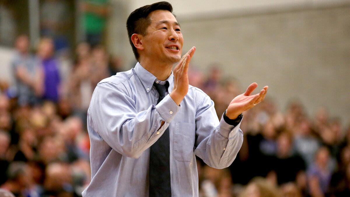 Coach Steve Baik applauds the effort of his Chino Hills team during a playoff game against Foothills Christian last season.