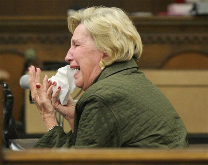 Former Downtown Waco Inc. executive director Margaret Mills cries in the courtroom Nov. 5, 2008 in Waco, Texas, after the judge agreed to accept a new plea agreement of nine years in prison. (AP Photo/Waco Tribune Herald, Jerry Larson, File)