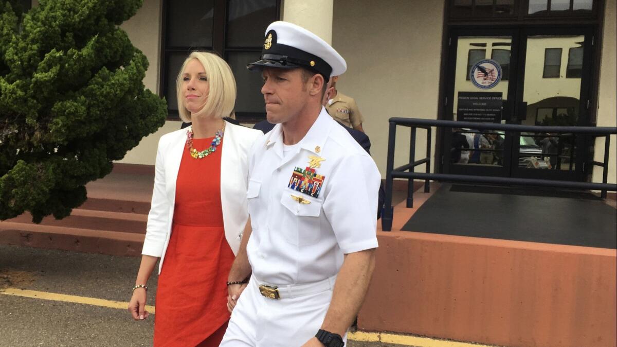 Navy Special Operations Chief Edward Gallagher leaves a military courtroom with his wife, Andrea Gallagher, last week after a judge freed him from custody pending trial.