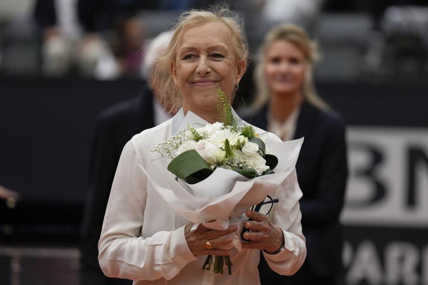 Martina Navratilova, the 18-time Grand Slam singles champion and member of the International Tennis Hall of Fame, smilesafter receiving the Racchetta d'Oro (Golden Racket) award from the Italian Tennis Federation ahead of the men's final tennis match at the Italian Open tennis tournament in Rome, Italy, Sunday, May 21, 2023. (AP Photo/Alessandra Tarantino)