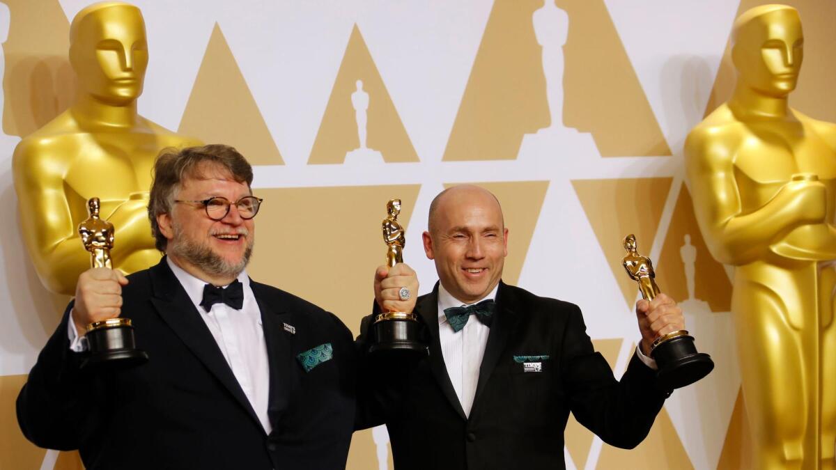 "The Shape of Water" producer-director Guillermo Del Toro, left, and producer J. Miles Dale at the 90th Academy Awards.