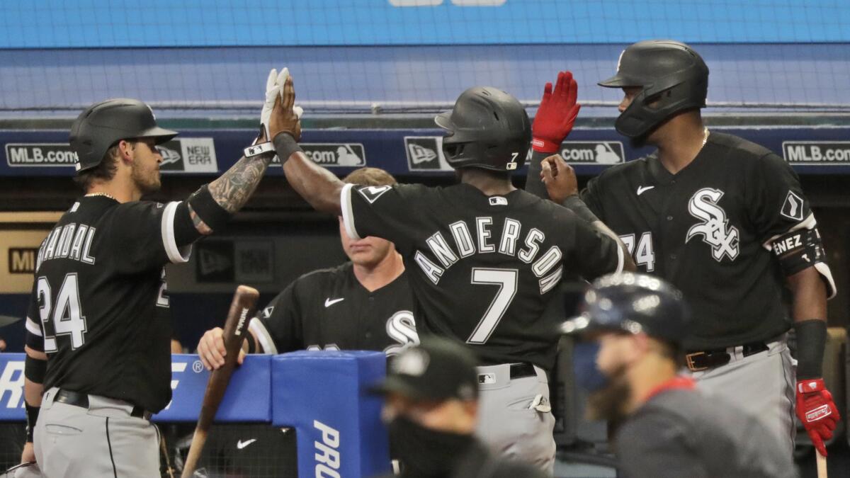 The Chicago White Sox baseball team congratulates each other with