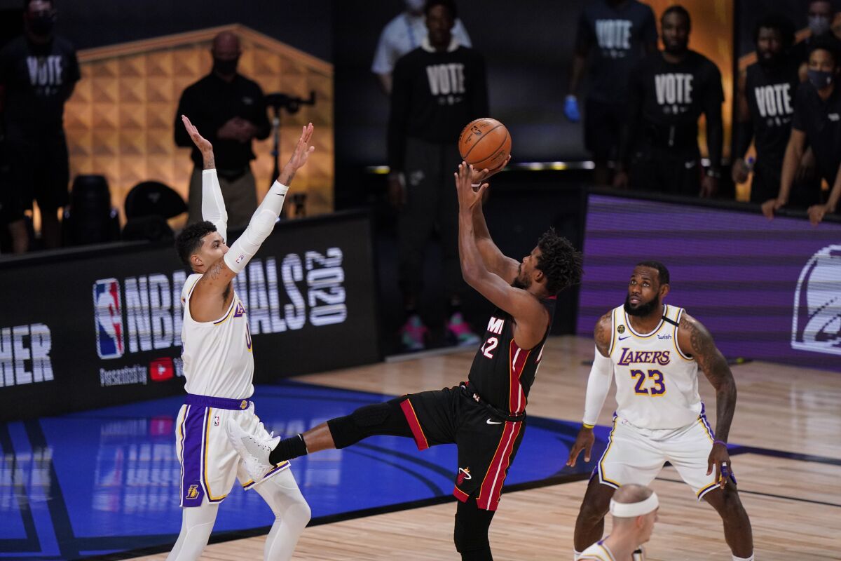 Heat guard Jimmy Butler attempts a fadeaway jumper over Lakers forward Kyle Kuzma during Game 3.