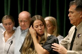 Los Angeles, CA - Brittany Lindskey is conforted by Los Angeles County Sheriff Robert Luna during a news conference at the Hall of Justice in downtown L.A. on Wedensday, Sept. 20, 2023, to announce charges against Kevin Cataneo Salazar, who is accused of gunning down Sheriff's Deputy Ryan Clinkunbroomer in Palmdale. Lindsey was Clinkunbroomer's fiancee. (Luis Sinco / Los Angeles Times)