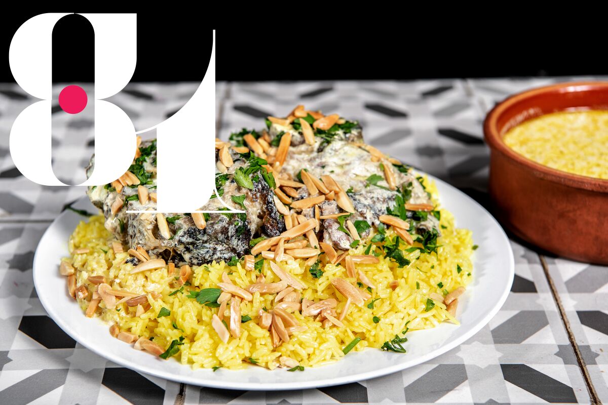 #81: Mansaf: lamb chunks placed over rice with a side of jameed with almonds and pine nuts from Al Baraka