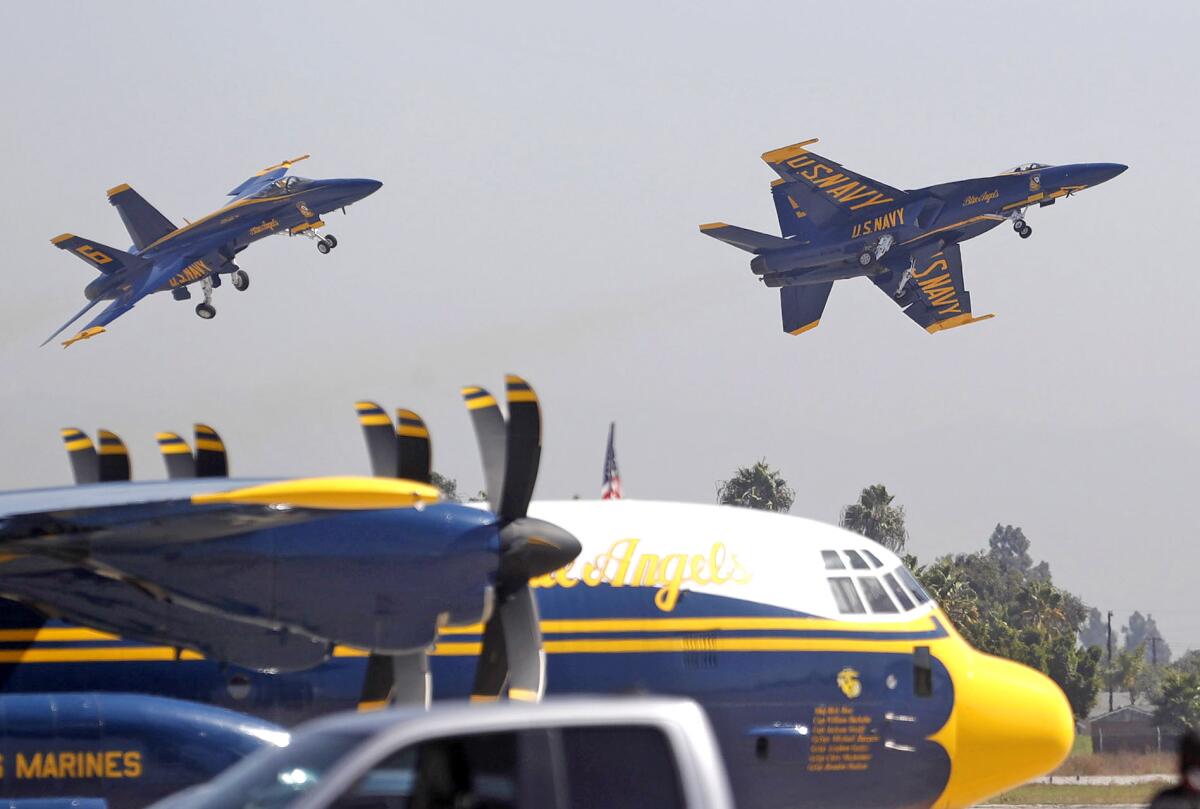 Members of the U.S. Navy Blue Angels flying team take flight.