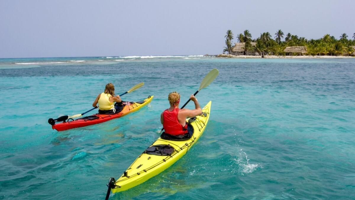Kayaking in the reef waters around Long Caye is one of the many ways to enjoy Belize.