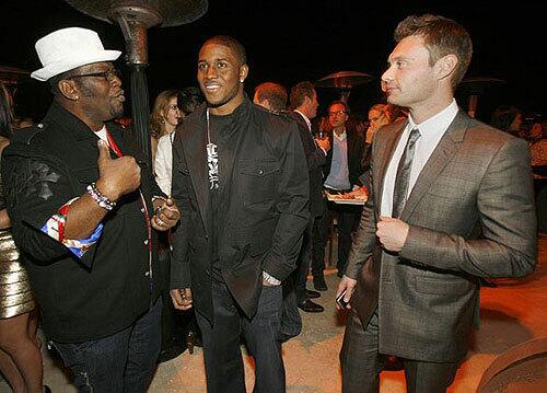 At Details magazine's recent party celebrating its April "Mavericks" issue, Randy Jackson, left, was outfitted in Five Four jeans, Xegna sweater, Patrick Cox shoes and his own label of eyewear. Reggie Bush wore Gucci, and Ryan Seacrest was in Versace.