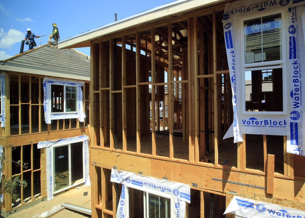 Homes under construction in Irvine on Aug. 19.