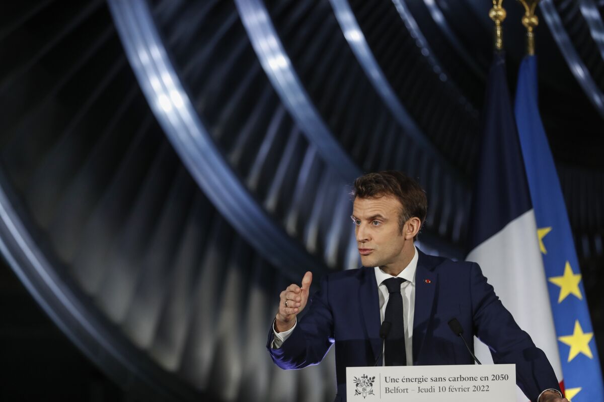 French President Emmanuel Macron delivers a speech at the GE Steam Power System main production site for its nuclear turbine systems in Belfort, eastern France, Thursday, Feb. 10, 2022. French President Emmanuel Macron unveiled plans to build new nuclear reactors in the country as part of its energy strategy to reduce planet-warming emissions. (AP Photo/Jean-Francois Badias, Pool)