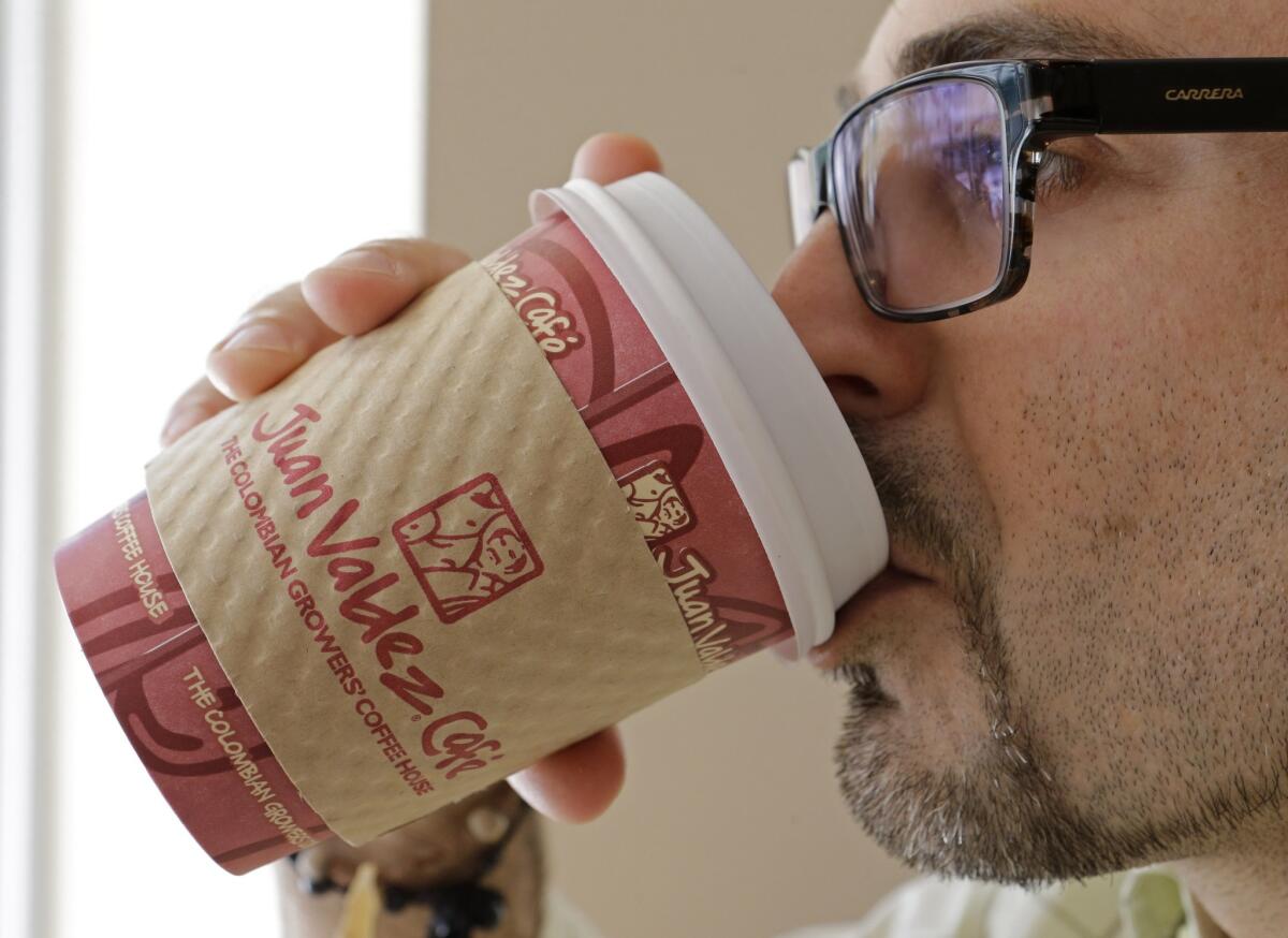 A man enjoys a coffee at a cafe in Miami. According new a new study, journalists and those that work in media drink the most coffee.