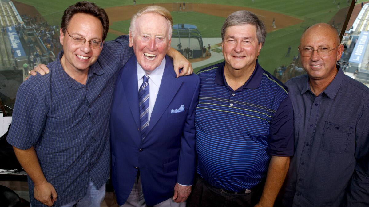 Dodgers announcer Vin Scully with his long-time support staff. From left, Rob Menschel, Scully, Boyd Robertson and Brian Hagan at Dodger Stadium.