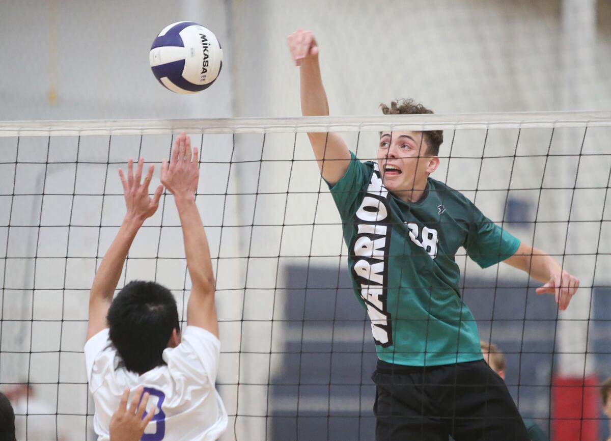 Brethren Christian's Logan Egan records a kill during an Express League match against Emerson Honors on April 16.