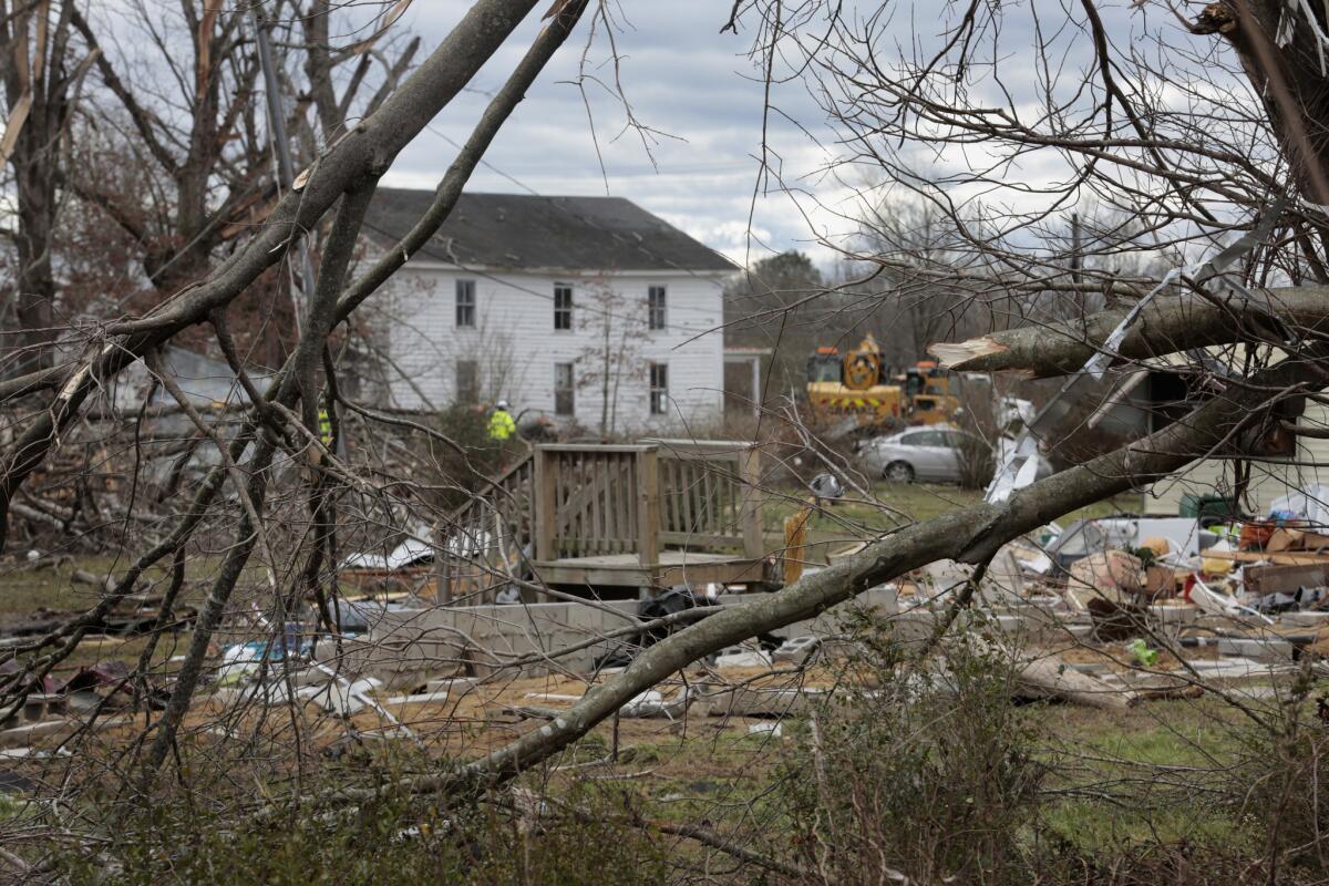 A staircase is left standing at the site of a house destroyed by tornadoes in Waverly, Va., a small town in which several people died.