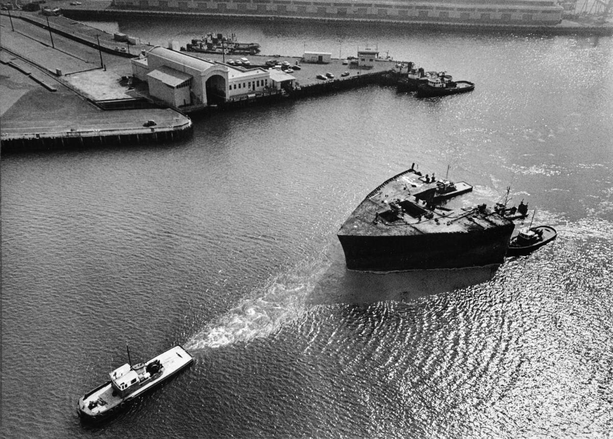 Feb. 19, 1977: The remaining 1,217-ton bow section of the Sansinena is towed to a Terminal Island scrap yard.
