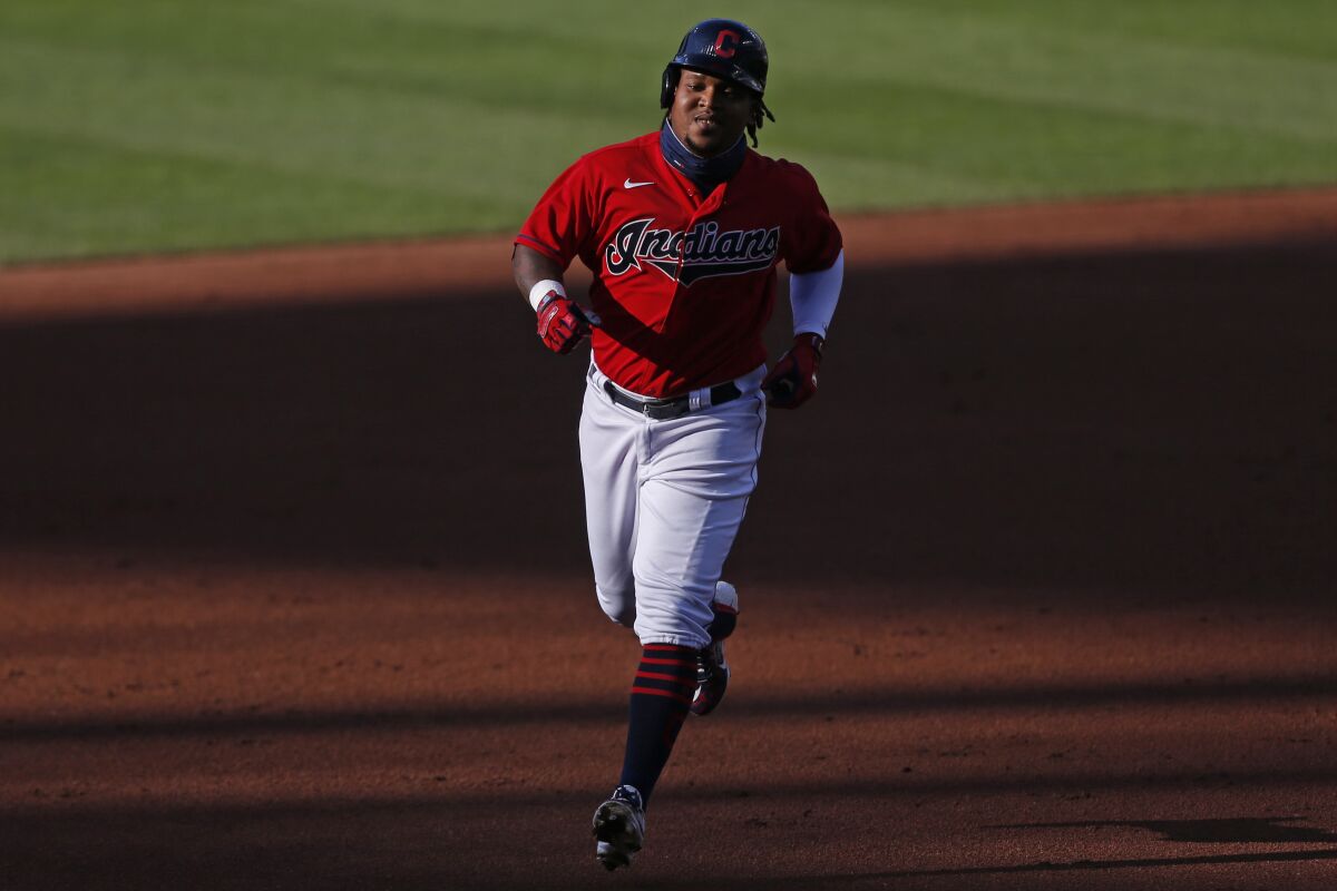 Cleveland Indians' Jose Ramirez runs the bases after hitting a solo home run off Cincinnati Reds starting pitcher Luis Castillo during the first inning of a baseball game at Progressive Field, Thursday, Aug. 6, 2020, in Cleveland. (AP Photo/David Dermer)