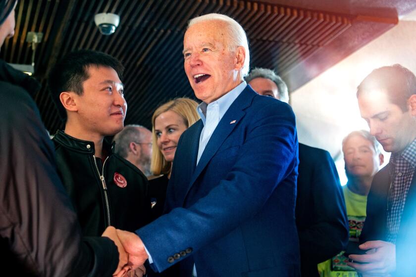 Democratic presidential candidate Joe Biden greets restaurant patrons at the Buttercup Diner in Oakland, Calif., on Super Tuesday.