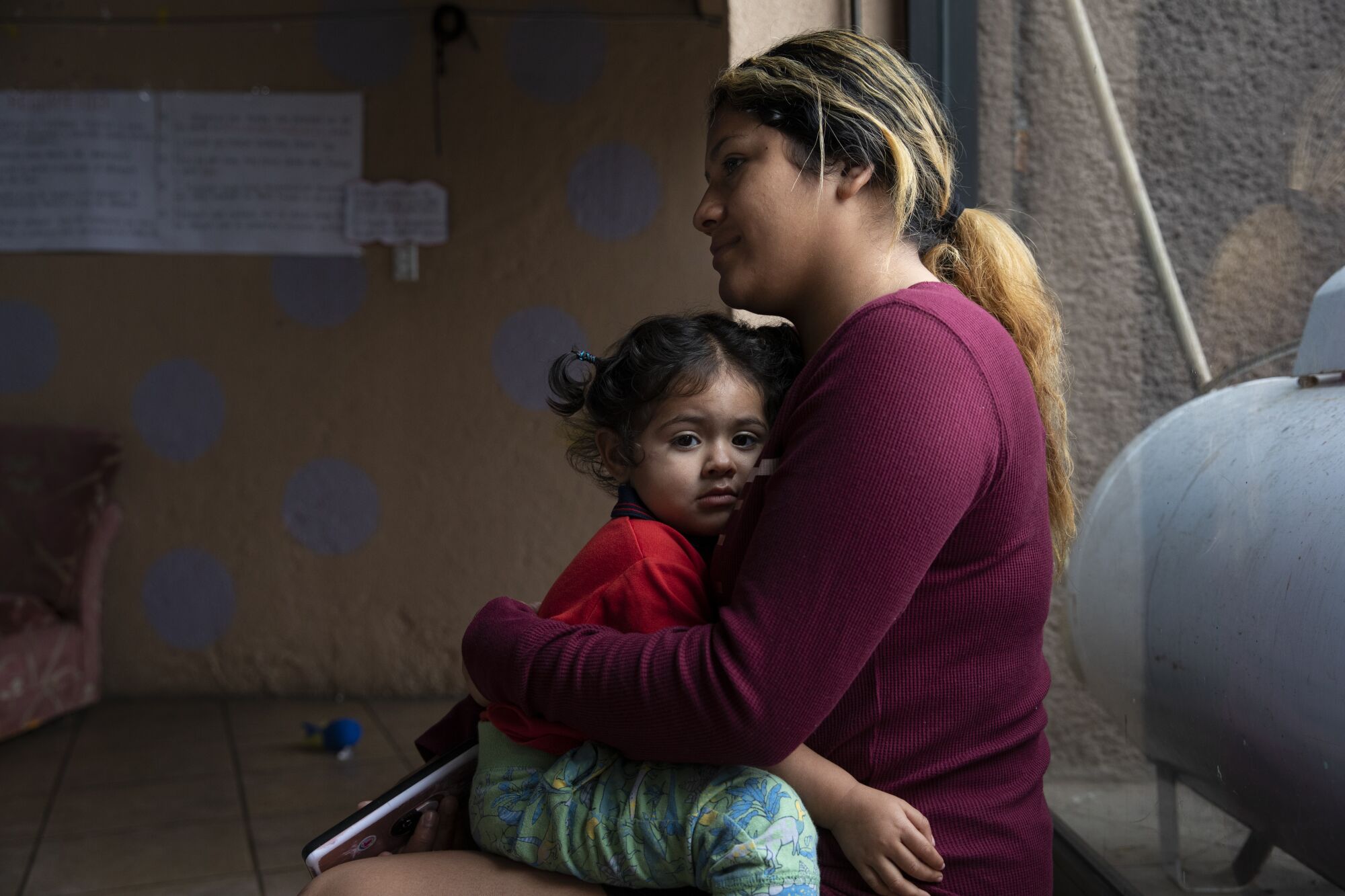 Nicolle Urbina, 20, holds her daughter Marlexy Martinez, 1,