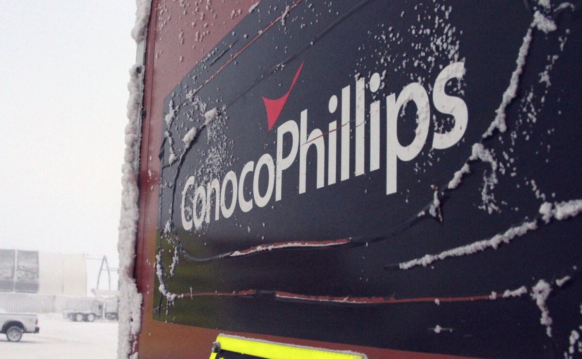 FILE - This Feb. 9, 2016, file photo shows an ice-covered ConocoPhillips sign at a drilling site in Nuiqsut, Alaska. Authorities are investigating a natural gas leak detected last week at a ConocoPhillips Alaska oil drill site on Alaska's North Slope, officials said. Grace Salazar, a special assistant with the Alaska Oil and Gas Conservation Commission, said Wednesday, March 9, 2022, that the commission that oversees oil and gas drilling in the state is investigating the matter. (AP Photo/Mark Thiessen, File)