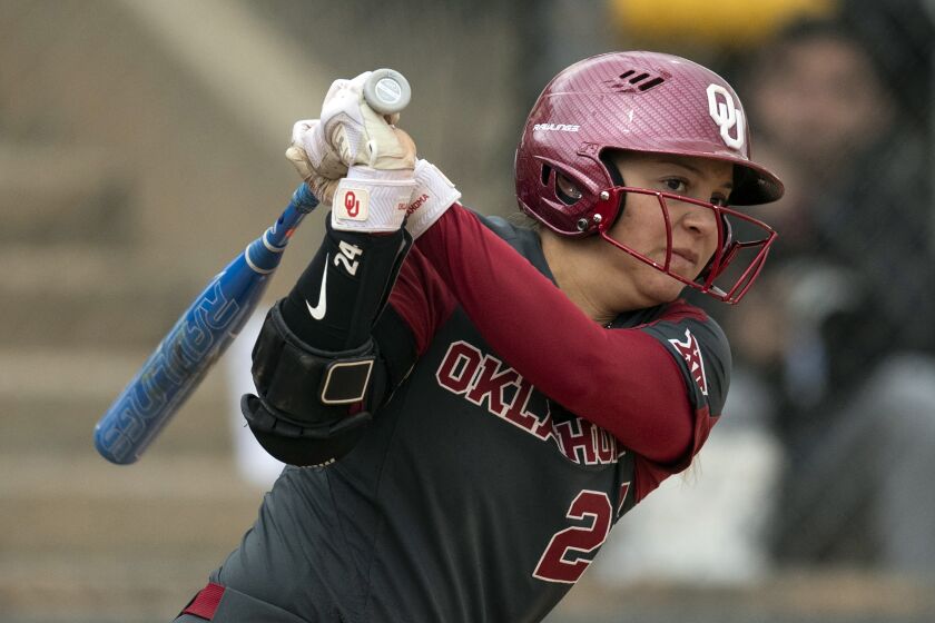 FILE - Oklahoma's Jayda Coleman (24) bats during an NCAA college softball game against Texas A&M on Friday, Feb. 24, 2023, in Cathedral City, Calif. (AP Photo/Kyusung Gong, File)