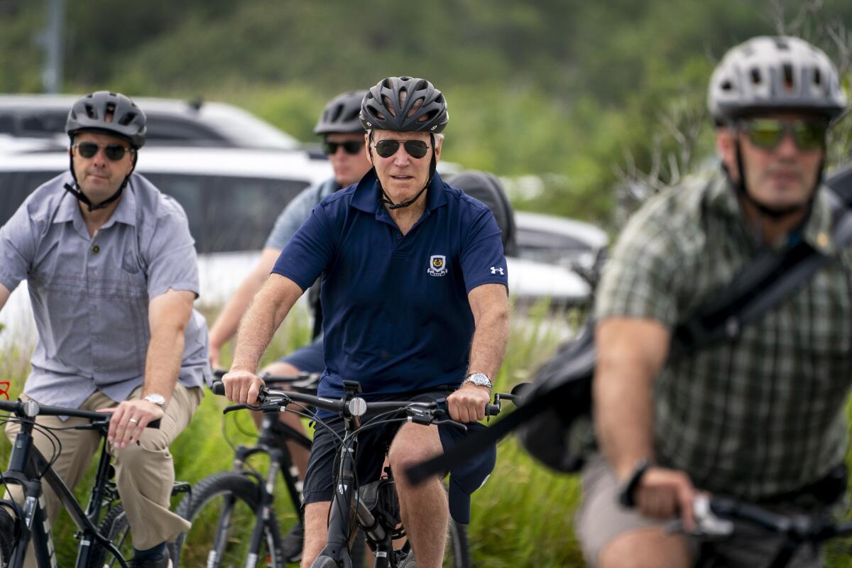 President Joe Biden goes on a bike ride in Gordons Pond State Park in Rehoboth Beach, Del., Sunday, July 10, 2022. (AP Photo/Andrew Harnik)