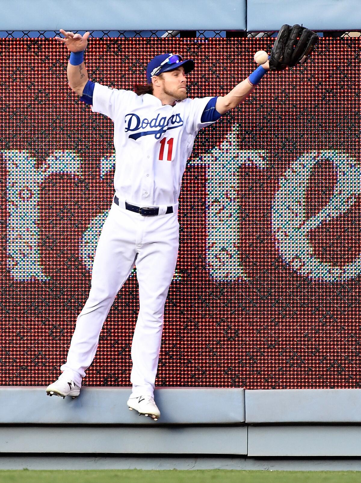 Dodgers Justin Turner celebrates after scoring in first inning against Nationals.
