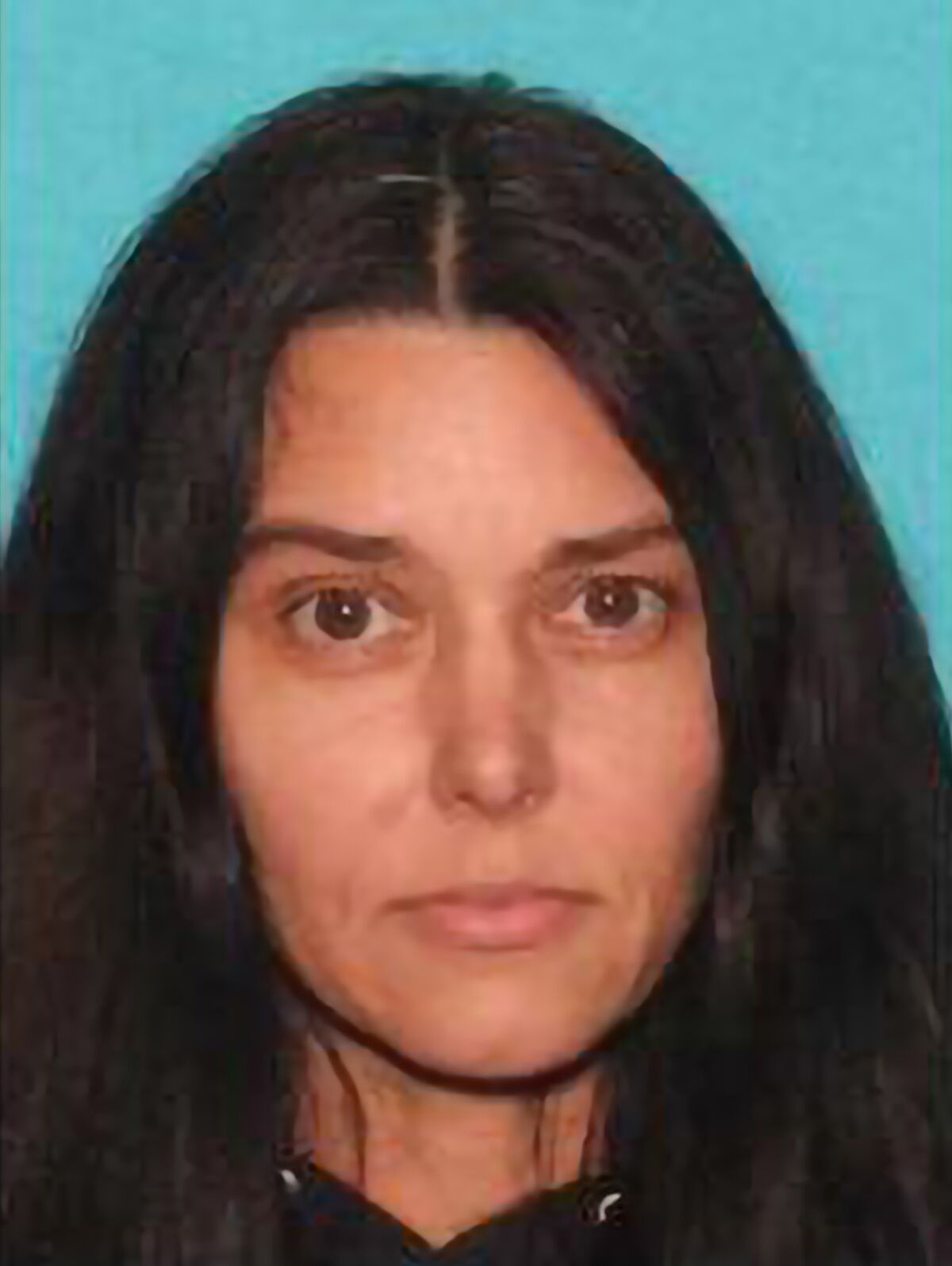 This photo provided by the Santa Ana Police Department shows Jade Benning who has been arrested in Texas for the 1996 stabbing death of her boyfriend in Southern California. Benning was taken into custody Tuesday near her home in Austin, Texas, according to police in Santa Ana, California. It wasn't immediately known if the 48-year-old has an attorney. (Santa Ana Police Department via AP)