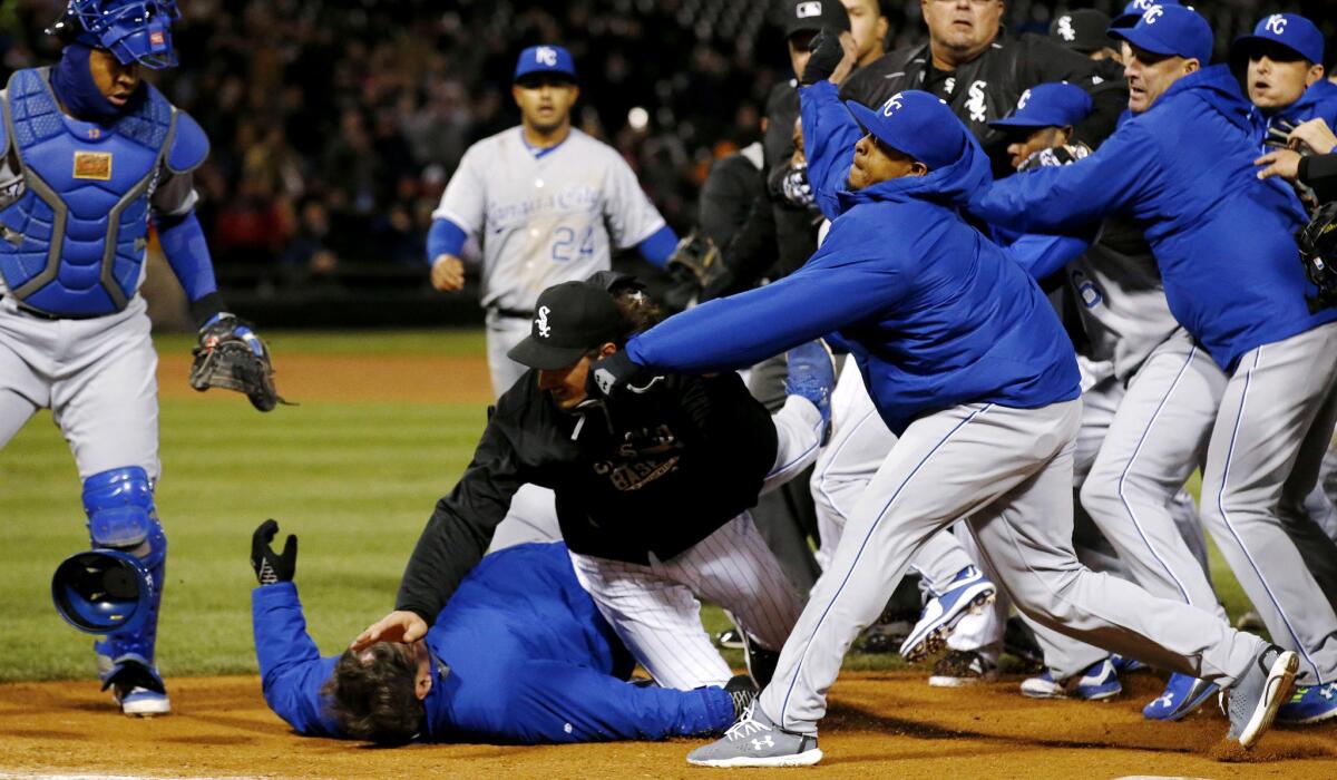 White Sox pitcher Jeff Samardzija (black jacket) tussles with Royals players during a benches-clearing brawl in the seventh inning of a game April 23 in Chicago.
