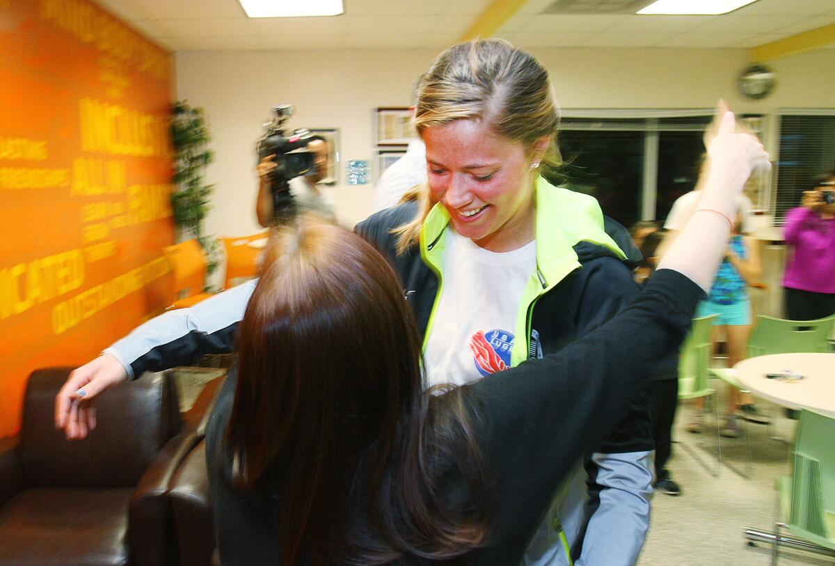 Olympian Kate Hansen greets a friend as she arrives for interviews and sign autographs at the Crescenta-Cañada Family YMCA in La Canada on Tuesday, March 11, 2014.