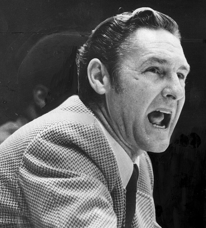 Lakers coach Bill Sharman yells instruction from the bench during the 1971-72 season.