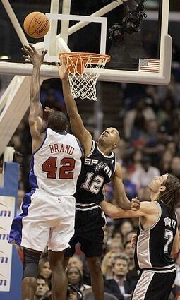 Clippers Elton Brand goes up for a shot over Spurs Bruce Bowen.