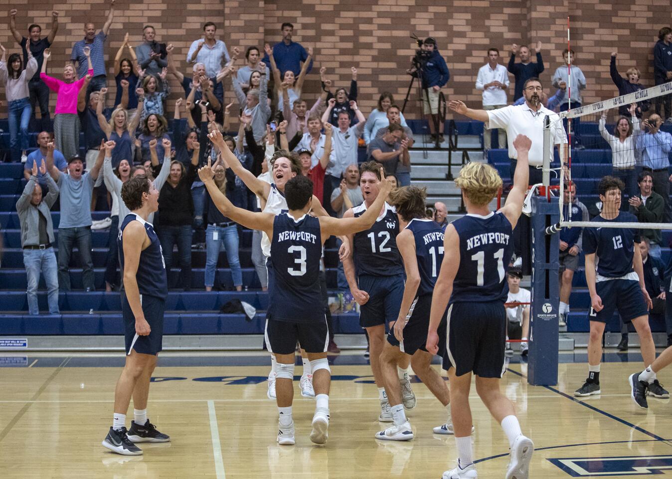 Newport Harbor High celebrates after earning a 25-20, 25-17, 25-23 sweep at Los Angeles Loyola in the semifinals of the CIF Southern Section Division 1 playoffs on Wednesday.