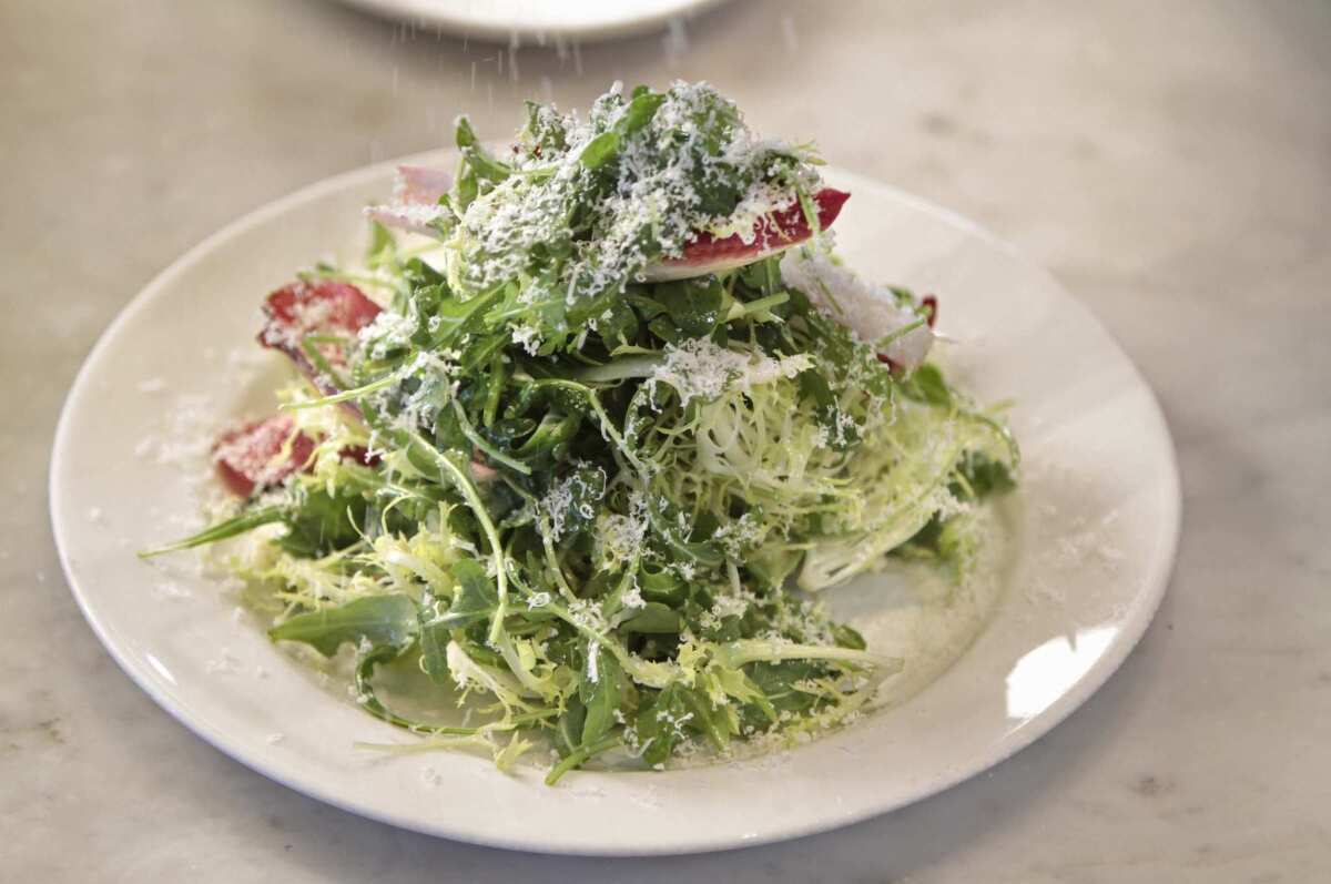 Master chef Nancy Silverton creates a salad named - "Tricolore with Parmigiano-Reggiano and Anchovy Dressing" at Mozza restaurant on Melrose Ave in L.A.