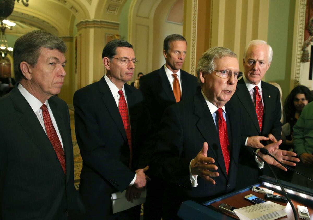 Senate Minority Leader Mitch McConnell (R-Ky.) speaks to reporters Tuesday after attending a weekly Republican policy luncheon.