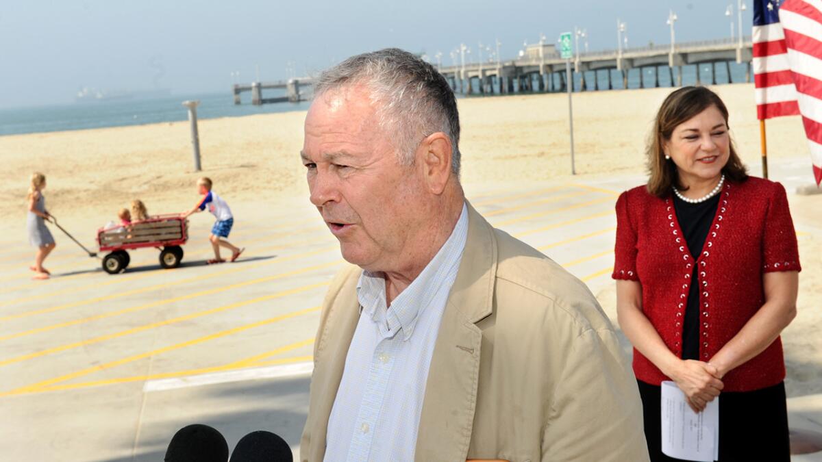 U.S. Rep. Dana Rohrabacher (R-Costa Mesa) appears with U.S. Rep. Loretta Sanchez (D-Santa Ana) at Belmont Pier in Long Beach to promise federal action to help prevent and mitigate the damage of coastline oil spills.