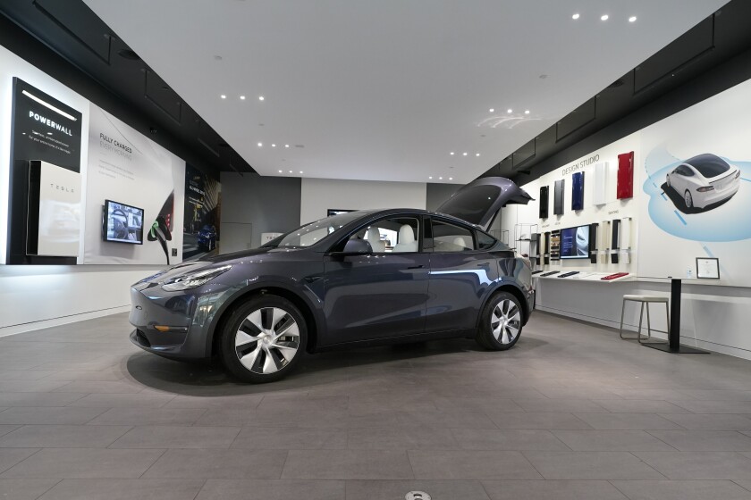 FILE - A Tesla Model Y Long Range is displayed on Feb. 24, 2021, at the Tesla Gallery in Troy, Mich. Tesla is recalling nearly 27,000 vehicles in the U.S. because the cabin heating systems may not defrost the windshield quickly enough. The latest in a series of recent recalls covers certain 2021 and 2022 Models 3, S, and X, and some 2020 through 2022 Model Y vehicles. (AP Photo/Carlos Osorio, File)