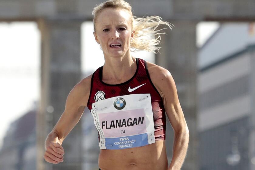 Shalane Flanagan, shown finishing the Berlin Marathon, is a favorite in the U.S. Olympic trials marathon on Saturday.