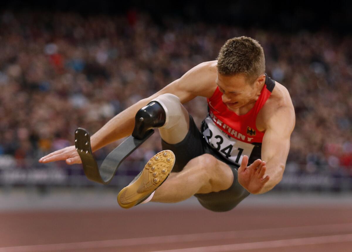 Germany's Markus Rehm makes a world record jump of 7.14 meters in the men's long jump at the 2012 Paralympics in London.