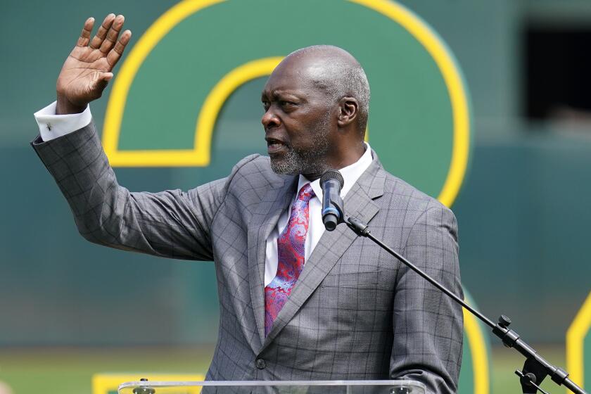 Dave Stewart waves to the crowd during his induction ceremony into the Oakland Athletics' Hall of Fame on Sept. 11, 2022.