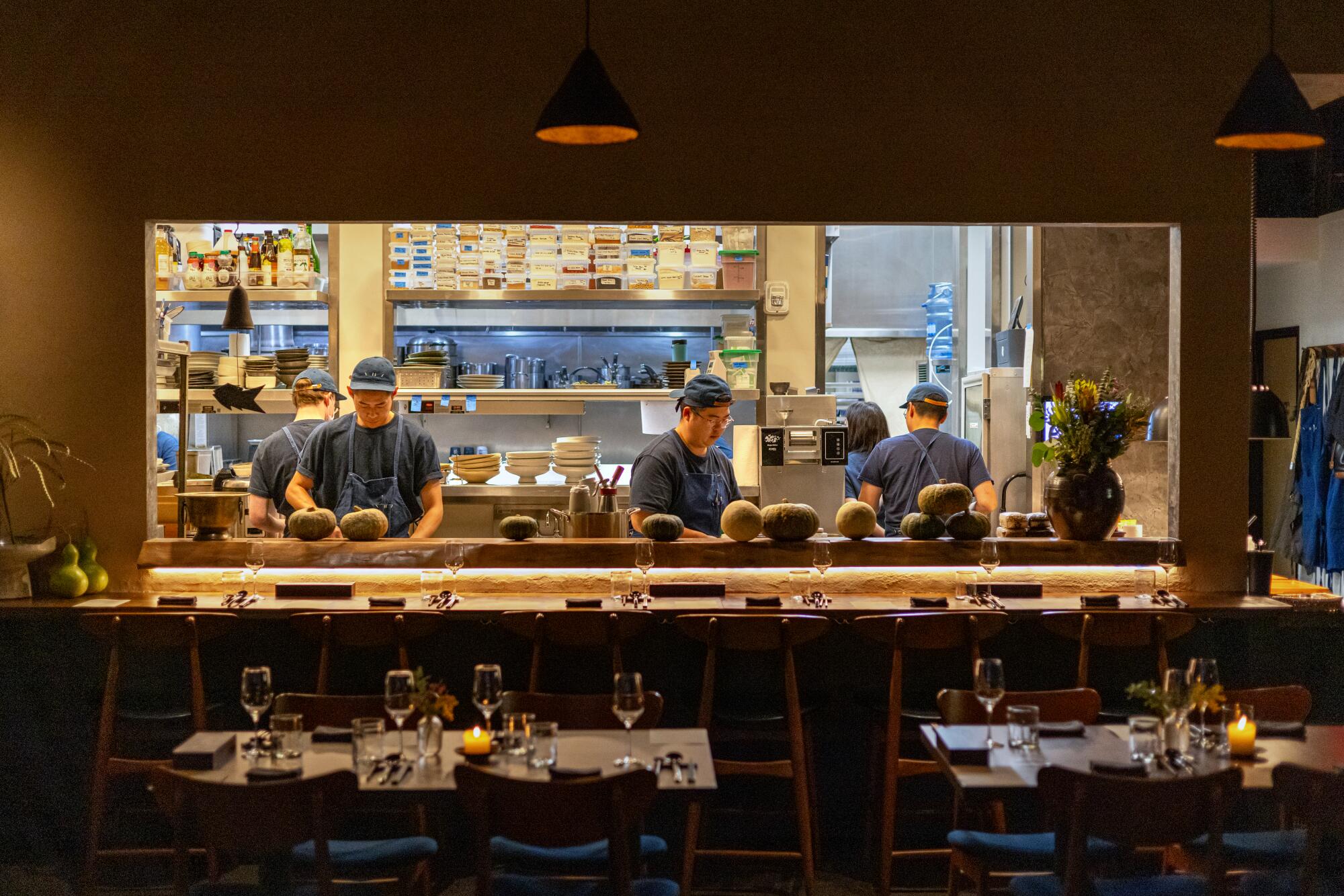 The open bar at Baroo gives diners a glance into the bustling kitchen.